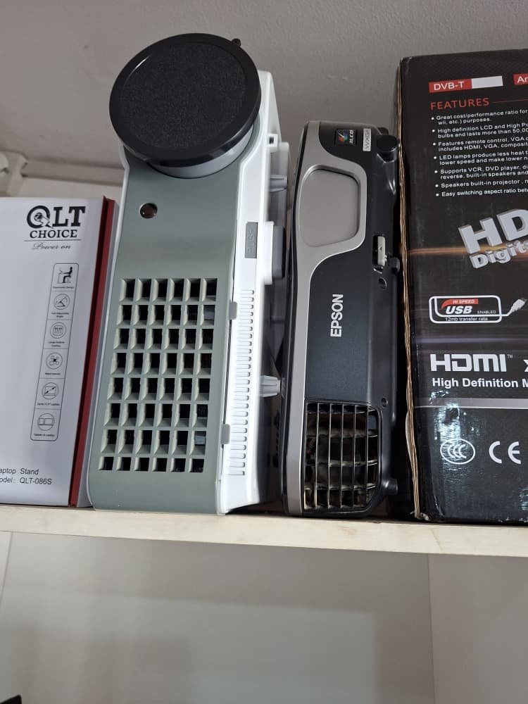 Projectors and networking boxes on a shelf at SATT Computers