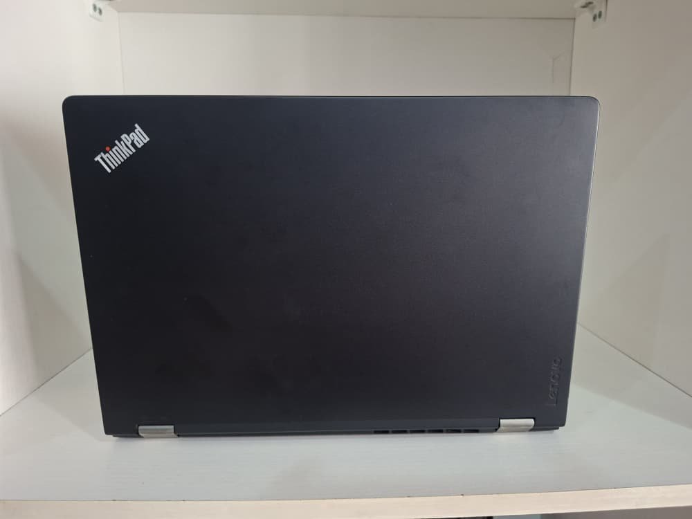 A closed Lenovo ThinkPad laptop ready for pickup